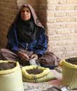 iran, kerman, woman selling iranian spice